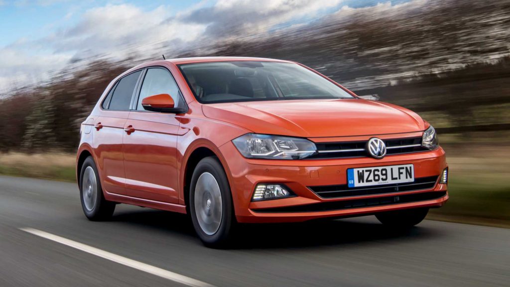Orange Volkswagen Polo driving outside after new windscreen replacement