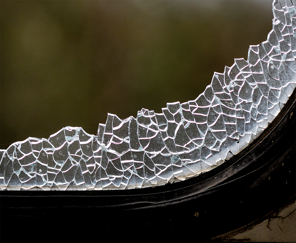 Tempered car glass broken into small harmless pieces