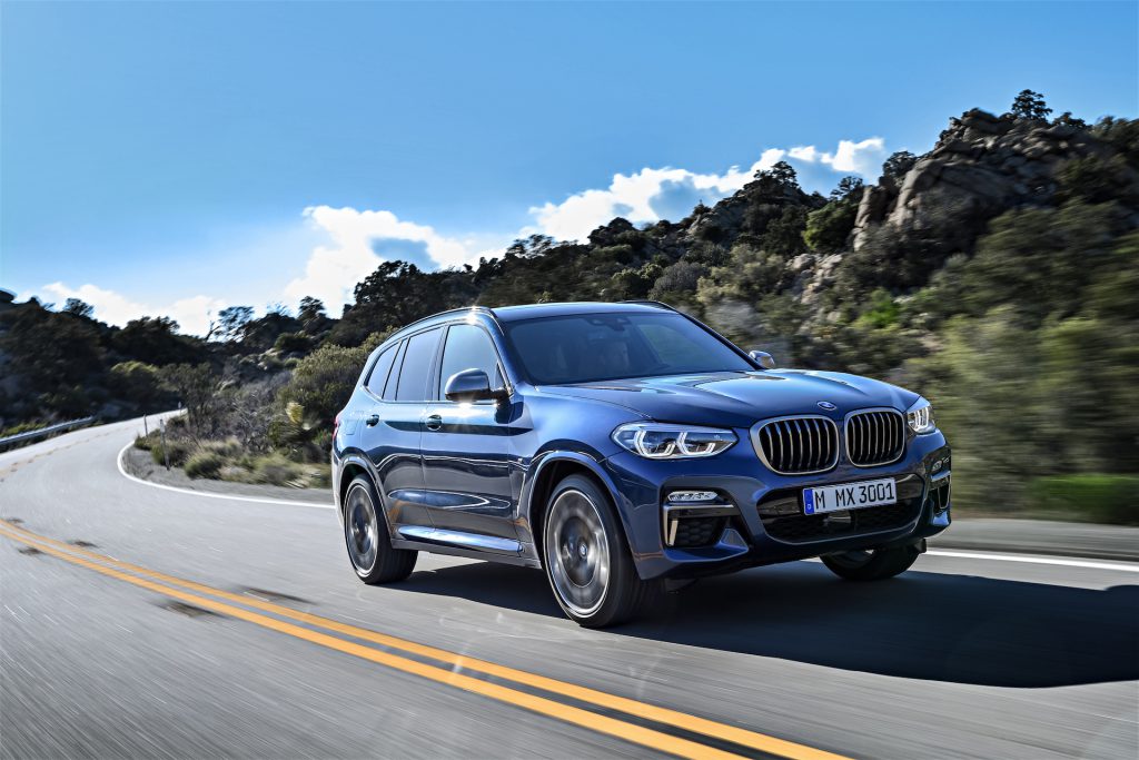 Blue BMW X3 on the road safely after a windscreen replacement